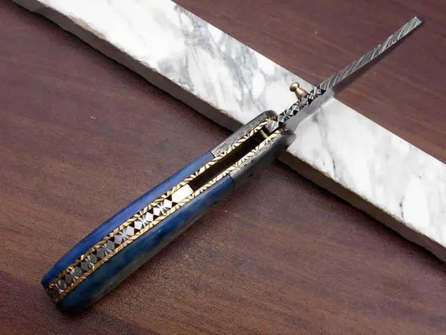 Alt view image 3 of 7 - Hand forged Damascus steel 7.8" folding custom Ledder patren knife 3.5" Blade Colored Bone & Damascus bolster scale cow leather sheath