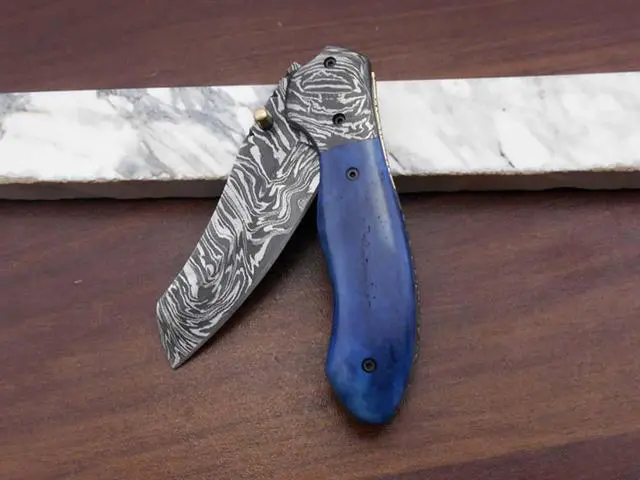 Alt view image 6 of 7 - Hand forged Damascus steel 7.8" folding custom Ledder patren knife 3.5" Blade Colored Bone & Damascus bolster scale cow leather sheath