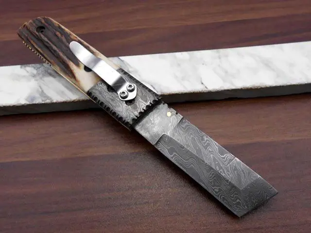 Alt view image 3 of 7 - Damascus steel Tanto blade Folding Knife, Available in Natural Ram, Bull horn, Camel Bone, Stag Antler scales with Damascus bolster, Cow hide leather sheath, equipped with Thumb knob & liner lock