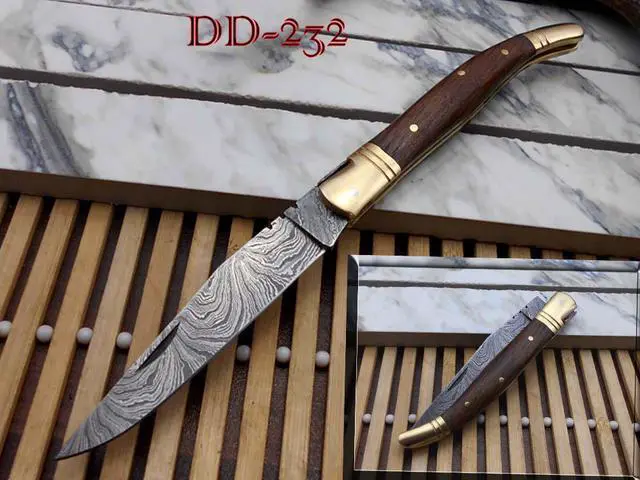 Main image of Laguiolle Folding Damascus steel knife. hand forged custom twist pattern 4" Blade. Available in various scales with brass bolster. Cow hide leather sheath Included