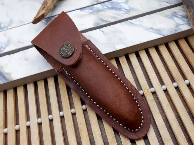 Alt view image 5 of 5 - Laguiolle Folding Damascus steel knife. hand forged custom twist pattern 4" Blade. Available in various scales with brass bolster. Cow hide leather sheath Included