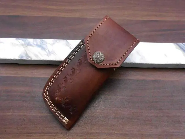 Alt view image 3 of 7 - 7.5" long Damascus steel Folding Knife with pocket clip, Available in Red Blue, Black & white colors scales with Damascus bolster, custom made 3" Hand Forged blade,  cow hide leather sheath
