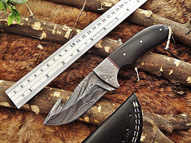 gut hook skinning knife with leather sheath