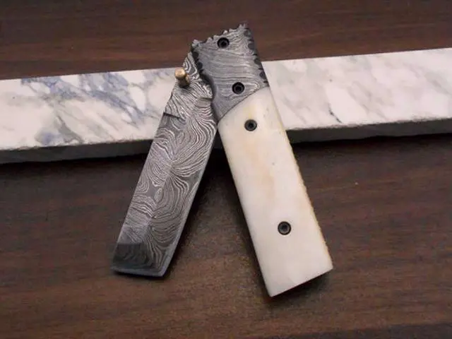 Alt view image 5 of 7 - Damascus steel Tanto blade Folding Knife, equipped with Thumb knob & liner lock, Available in various natural scales with Damascus bolster, Cow hide leather sheath