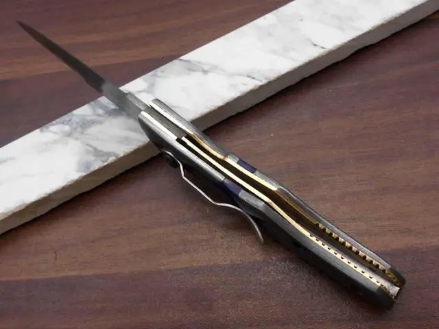 Alt view image 2 of 7 - 8" long Folding Knife with pocket clip, Hand forged Damascus steel 3.5" blade. Available in Walnut wood, Bull horn, Ram Horn, Red & Blue scale with Damascus Bolster, Cow hide Leather sheath