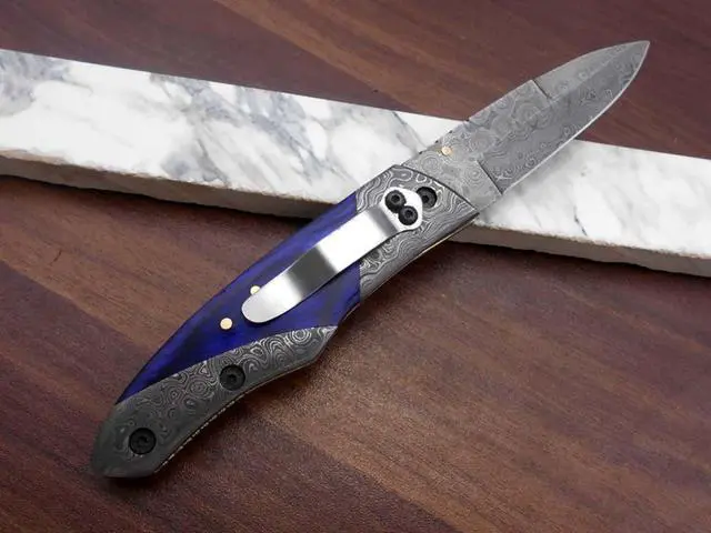 Alt view image 3 of 7 - 8" long Folding Knife with pocket clip, Hand forged Damascus steel 3.5" blade. Available in Walnut wood, Bull horn, Ram Horn, Red & Blue scale with Damascus Bolster, Cow hide Leather sheath