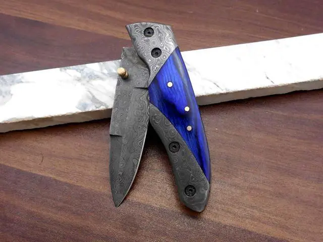 Alt view image 6 of 7 - 8" long Folding Knife with pocket clip, Hand forged Damascus steel 3.5" blade. Available in Walnut wood, Bull horn, Ram Horn, Red & Blue scale with Damascus Bolster, Cow hide Leather sheath