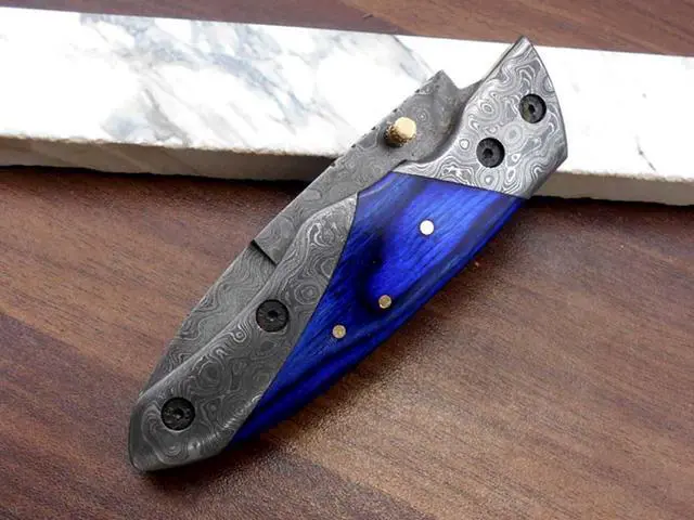 Alt view image 7 of 7 - 8" long Folding Knife with pocket clip, Hand forged Damascus steel 3.5" blade. Available in Walnut wood, Bull horn, Ram Horn, Red & Blue scale with Damascus Bolster, Cow hide Leather sheath