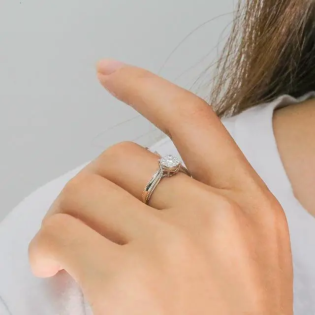 Alt view image 5 of 7 - 18K Gold Halo Ring with 1 Carat Main Diamond and 0.1 Carat Accented Diamonds, D Color, VVS1 Clarity, Round Cut