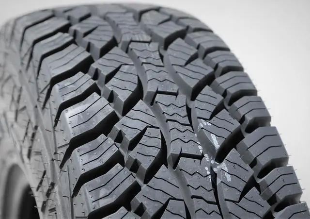 Alt view image 2 of 7 - 285/70R17 121/118S D (8 Ply) - Evoluxx Rotator A/T All-Terrain Tire