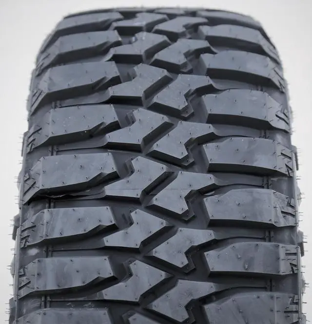 Alt view image 2 of 7 - 275/70R18 125/122Q E (10 Ply) (OWL) - Evoluxx Rotator M/T Mud Tire