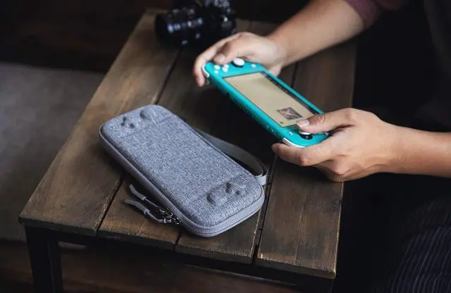 Alt view image 7 of 7 - Ultra Slim Case for Nintendo Switch Lite Original Patent Protective Portable Carrying Case Travel Storage Hard Shell with 8 Game Cartridges and Military Level Protection Gray