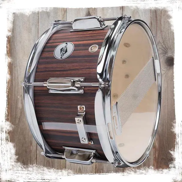 Alt view image 6 of 7 - GRIFFIN Firecracker Snare Drum | Acoustic Popcorn 10" x 6" Poplar Mini Wood Shell & Black Hickory PVC | Concert Marching Percussion Musical Instrument with Deluxe Snare Throw Off, Drummers Key & Head