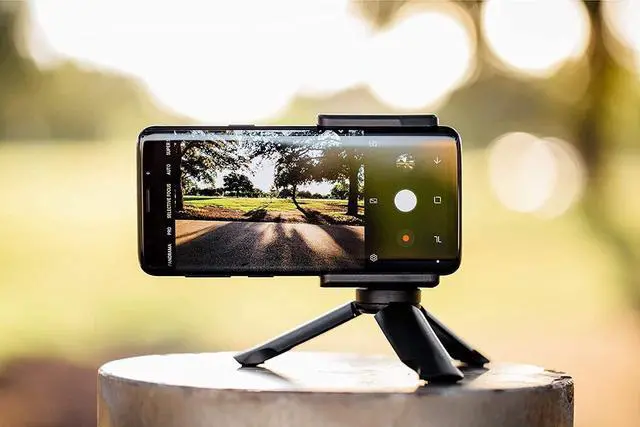 Alt view image 3 of 4 - Adonit Photogrip (Black) Shutter Remote Bluetooth Selfies Included Tripod, Travel Case, Mini Stylus. Smartphone HandGrip Camera Stable Shots for iPhone, Android, Samsung, LG, Google Pixel, HTC