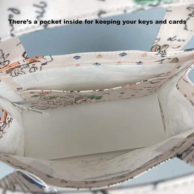 Alt view image 7 of 7 - Cath Kidston x Peter Rabbit Limited Edition Small Bookbag Open Top Handled Handbag Lunch Bag Water Resistant Oilcloth Tote Floral Pattern Cream