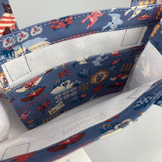 Alt view image 5 of 5 - Cath Kidston S Bookbag Small Size Open Top Handled Handbag Lunch Bag Water Resistant Oilcloth Tote Seasonal Greeting and Floral Pattern Dreamer Multi Blue Color