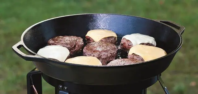Alt view image 5 of 7 - Lodge 17 Inch Pre-Seasoned Cast Iron Skillet - Dual Assist Handles - Use in the Oven, on the Stove, on the Grill, or Over a Campfire - Black
