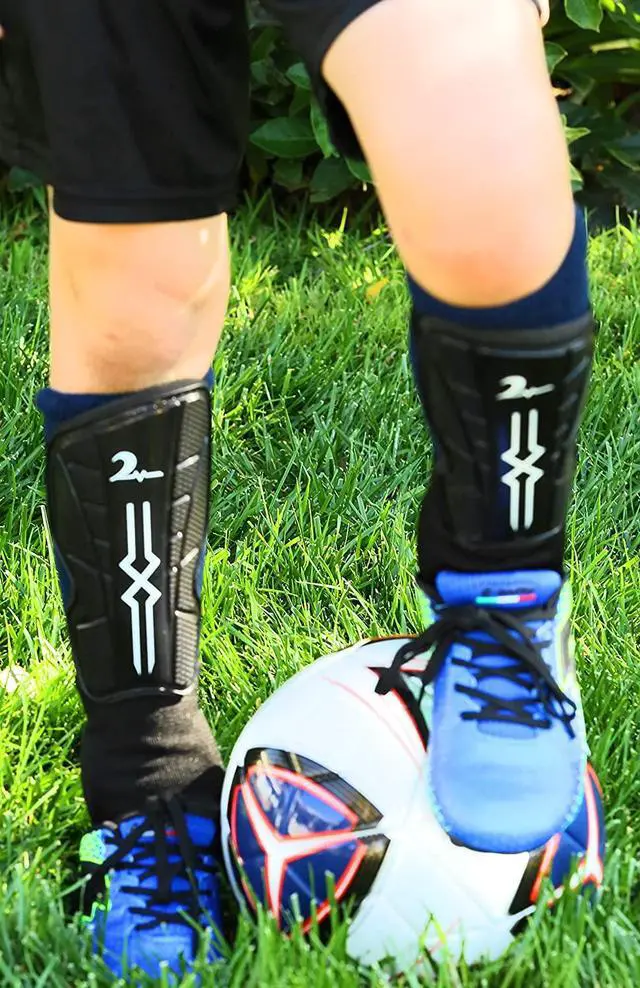 Alt view image 4 of 7 - Swell Relief Soccer Shin Guards for Kids/Soccer Gear for Boys Girls/Protective Soccer Equipment/Adjustable Straps (Red, Medium)
