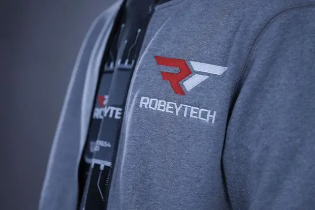 Alt view image 4 of 4 - The Premier Robeytech Logo on a New Era French Terry Baseball Full-Zip jacket in Light Graphite Twist. The perfect combination for our first jacket.