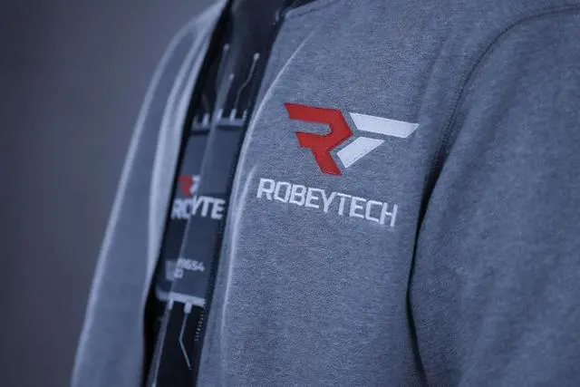 Alt view image 3 of 4 - The Premier Robeytech Logo on a New Era French Terry Baseball Full-Zip jacket in Light Graphite Twist. The perfect combination for our first jacket.