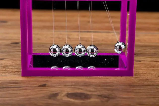 Alt view image 2 of 3 - Newtons Cradle Balance Balls, 5 Pendulum Balls, with Mirror Desk Top Decoration Kinetic Motion Toy for Home and Office, Physics Toys for Teachers (Purple)