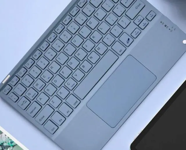 Main image of Bluetooth keyboard is suitable for mobile phones, tablets (such as iPad) with touch screen, magnetic attachment, silent mode, office use, full-color, wireless keyboard. Deep Sea Blue