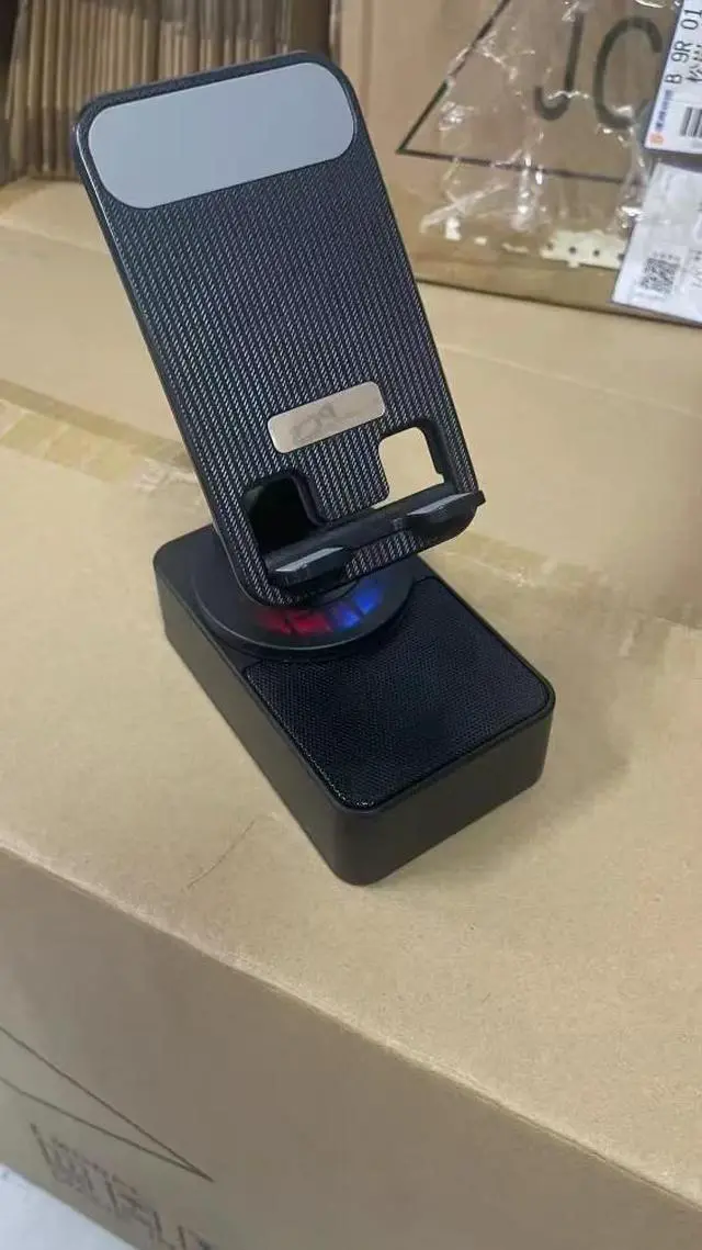 Main image of 2025 New Three-in-one mobile phone holder Bluetooth speaker charging treasure call speaker multi-function colored light foldable desktop