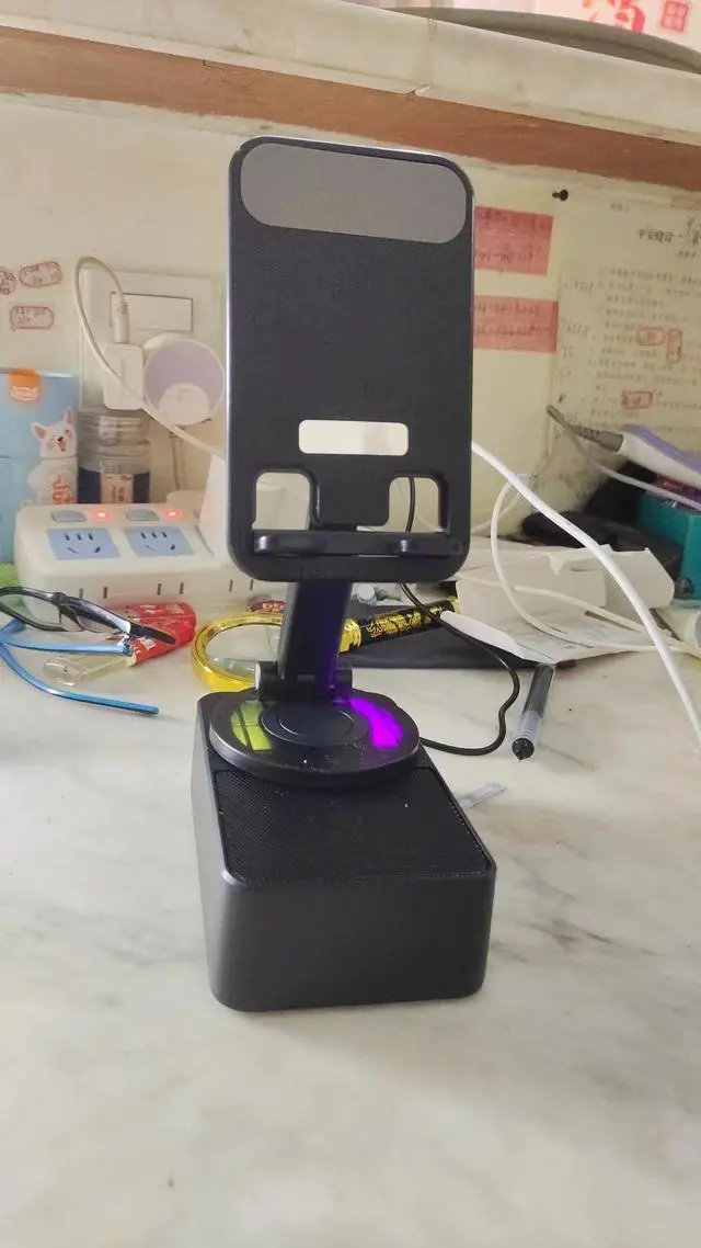 Alt view image 5 of 6 - 2025 New Three-in-one mobile phone holder Bluetooth speaker charging treasure call speaker multi-function colored light foldable desktop