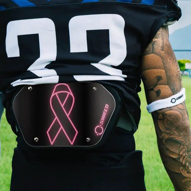 Alt view image 6 of 6 - O Shield Pink Ribbon Football Back Plate, Lower Back Pads for Football Players, Rear Protector, Universal Fit, BCRF (Breast Cancer Research Foundation) Supporter - Youth
