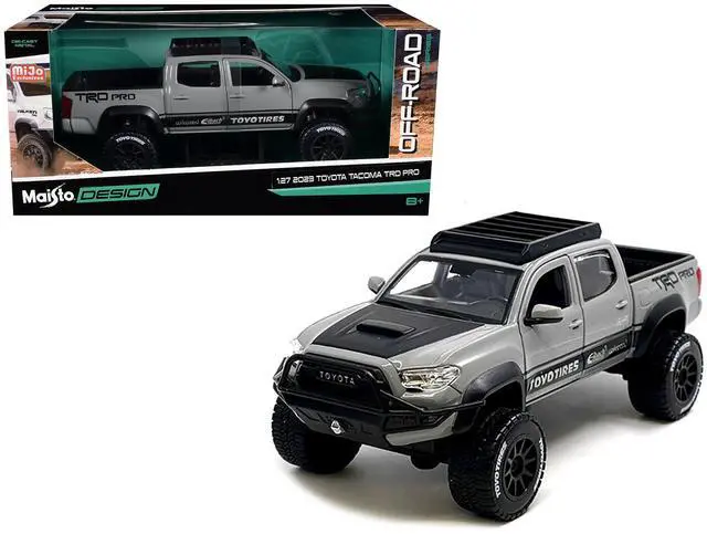 Alt view image 7 of 7 - 2023 Toyota Tacoma TRD PRO Off Road Truck Cement Gray with Black Hood and Roofrack 1/27 Diecast Model Car by Maisto