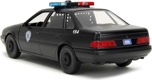 Alt view image 8 of 11 - Ford Taurus OCP Matt Black "Detroit Police" and Robocop Figure "Robocop" (1987) Movie 1/24 Diecast Model Car by Jada