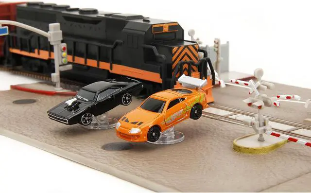 Alt view image 11 of 11 - "Fast & Furious" Final Race Diorama with Toyota Supra Orange and Dodge Charger Black "Nano Scene" Series model by Jada