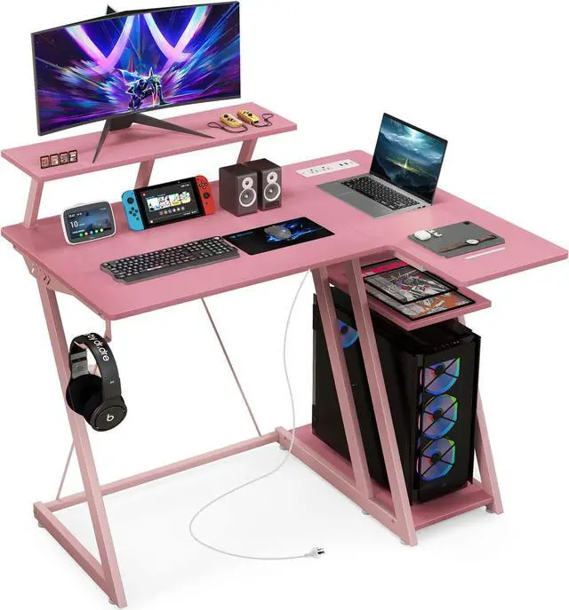 Main image of Tangkula L Shaped Gaming Desk with Power Outlets, Small Gaming Computer Desk 39inch with Storage Shelf, Corner Desk with Carbon Fiber Texture, Gamer Desk Gaming Table (Pink)
