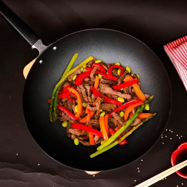 Alt view image 7 of 7 - JOYCE CHEN Professional Series 12-Inch Carbon Steel Excalibur Nonstick Stir Fry Pan with Phenolic Handle