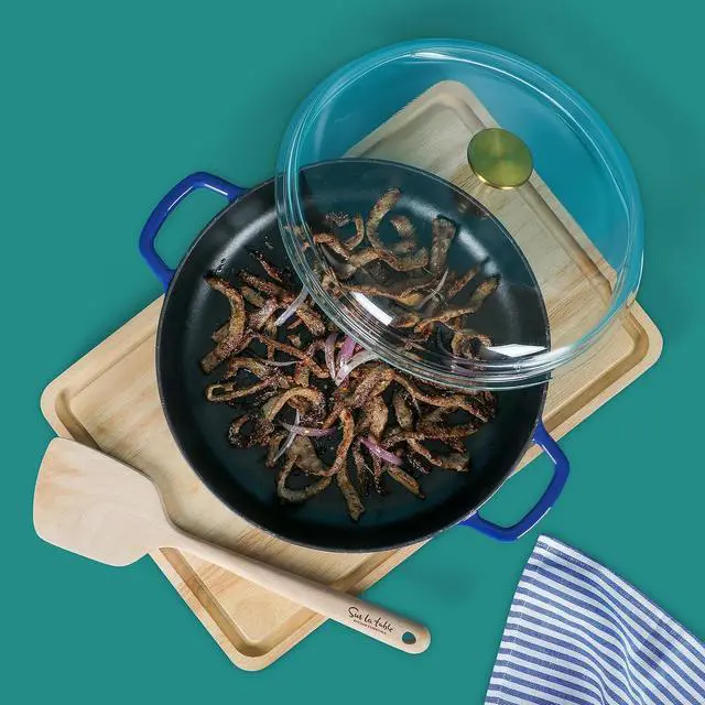 Alt view image 4 of 5 - Sur La Table Kitchen Essentials 3.75 Quart Enamel Cast Iron All In One Multi-Purpose Non-Toxic Nonstick Braiser Pan W/Borosilicate Glass Lid - Blue