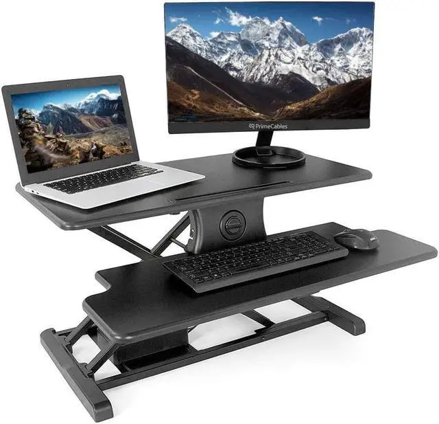 Main image of PrimeCables 31.5 inch Electric Standing Desk Converter, One-Touch Button Height Adjustable Sit Stand Desk Converter Keyboard Tray, Desk Riser Fits Dual Monitor and Laptop