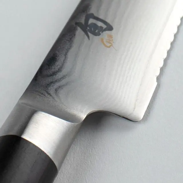 Alt view image 3 of 6 - Shun Classic 6" Serrated Utility Knife with D-Shaped Ebony Pakkawood Handle