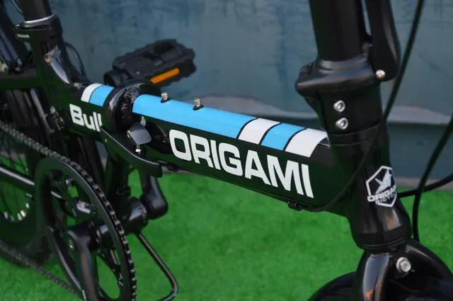 Alt view image 4 of 5 - The Origami Bull is our go anywhere, any road, no nonsense folding bike.  It has an aluminum frame, 9-speeds, disc brakes, fat 20x2.125 tires, Sensah derailleur, and 300 lb. capacity. Black/Blue