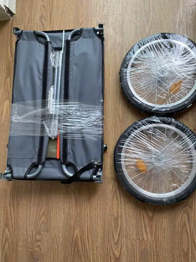 Alt view image 7 of 7 - The Origami folding utility trailer has capacity for four large grocery bags and folds flat with no tools required.  It is perfect for you RV or Boat, or just that trip to the grocery store.