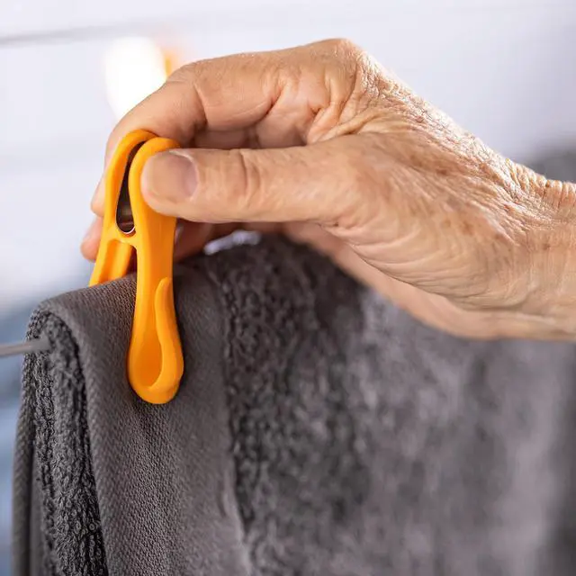 Alt view image 6 of 7 - Hegs - The Smartest Heavy Duty Clothespins with Hooks (24 Pack Orange, Pink, Blue) - Hang 3 Garments at Once with Our Tough, Dual Hooks Clothes Pins with Anti-Rust Spring - Tough, Colorful Clothespins