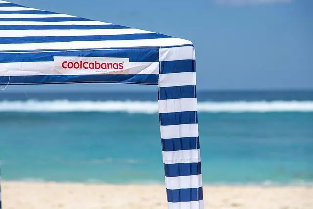 Alt view image 5 of 5 - CoolCabana Beach Shade Tent - Easy Setup, UPF 50+ Protection, Large & Medium Sizes, Compact & Wind Resistant - Beach Cabana for The Whole Family - Navy Stripes, Medium