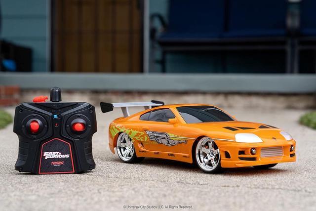 Alt view image 2 of 7 - Jada Toys Fast & Furious RC 1995 Toyota Supra Vehicle (1/16 Scale), Orange