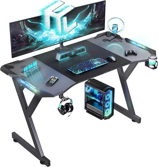 Main image of HLDIRECT 47 Inch Gaming Desk with LED Lights, Ergonomic Computer Table with Carbon Fibre Surface, Sturdy PC Workstation Desk for Home Office with Headphone Hook, Cup Holder, Black