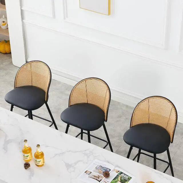 Alt view image 6 of 7 - Swivel Counter Height Bar Stools Set of 3, Mid Century Modern 26" Bar Chairs with Rattan Back & Metal Legs, Upholstered Faux Leather Barstools Island Stools for Kitchen Counter Home Bar,Black