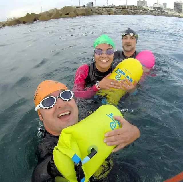 Alt view image 6 of 7 - New Wave Swim Buoy for Open Water Swimmers and Triathletes - Light and Visible Float for Safe Training and Racing - High Visiblity Fluo Green