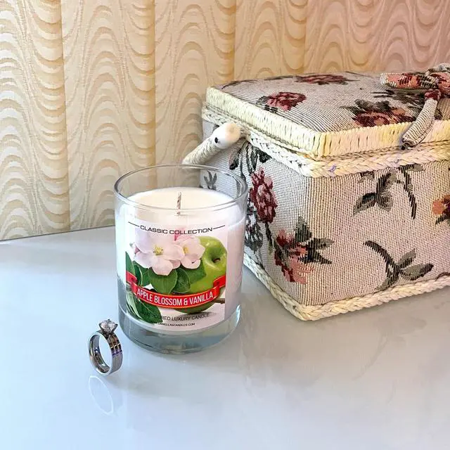 Alt view image 4 of 5 - Daniella's Candles - Apple Blossom and Vanilla Jewelry Candle with Necklace inside