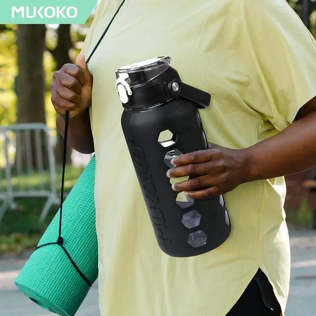Alt view image 6 of 7 - MUKOKO Glass Water Bottles 64oz with 2 Lids, Half Gallon Water Bottle with Straws and Measurements, 2L Sports Water Jug with Silicone Sleeve, Leakproof, Black