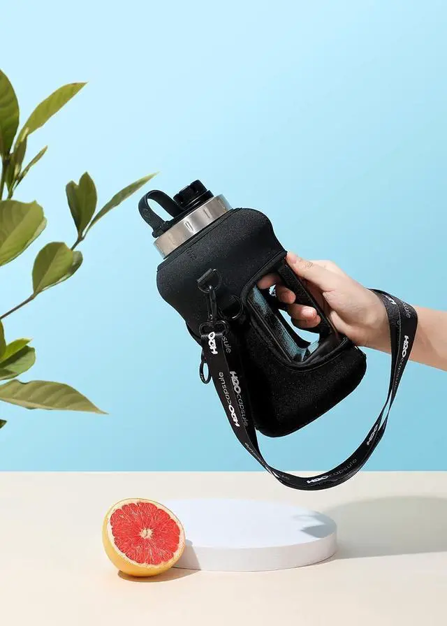 Alt view image 4 of 7 - H2O Capsule 2.2L Half Gallon Wide Mouth Water Bottle with Storage Sleeve and Removable Straw - Hydration Tracker Jug with Measurements Marked  Shatterproof BPA-Free, (Jet Black)