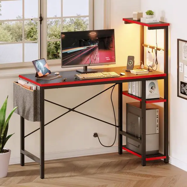 Main image of Bestier Gaming Desk with Power Outlets, 44 Inch Led Gamer Desk with 4 Tiers Reversible Shelves, PC Gaming Table with Headset Hook & Side Storage Bag for Bedroom (Black 3D Carbon Fiber)