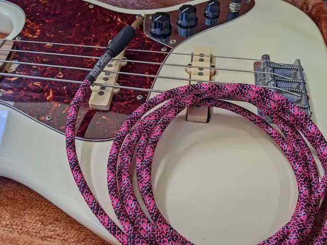 Alt view image 2 of 7 - Pig Hog PCH10GPK Pink Graffiti High Performance Instrument Cable 10-Feet Unique Woven Outer Covering Gold Plated 1/4" Straight Connectors